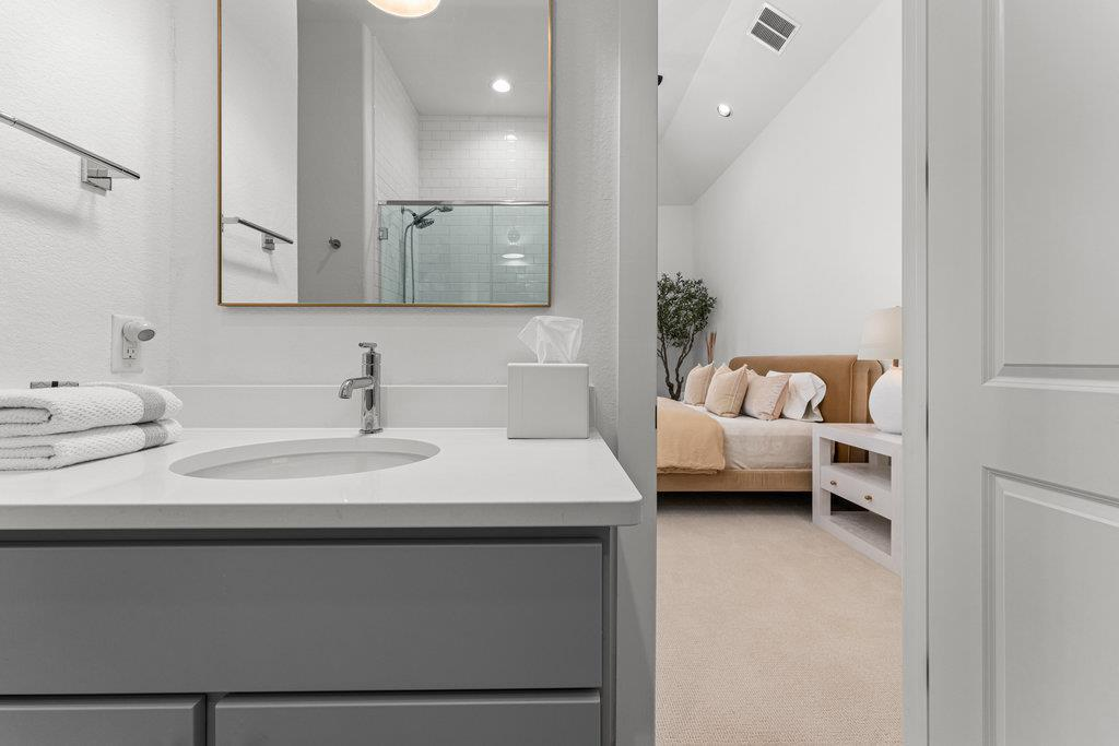 Casita en-suite bath with quartz vanity and view into bedroom